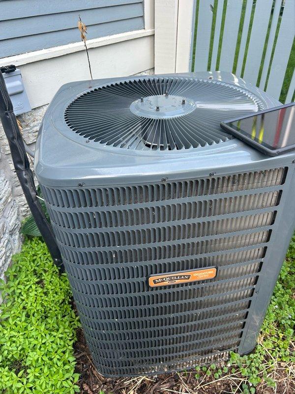 Responded to no cooling complaint and found condenser fan motor failed to operate while compressor continued running, causing system overheating and frozen evaporator coils. Tested universal capacitor which measured within acceptable range, confirming failed condenser fan motor as root cause. Identified and ordered replacement motor, secured customer approval, and disconnected power to unit to prevent compressor damage until return visit for installation and system restoration.