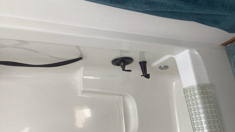 Installed customer-supplied tub/shower valve, lavatory faucet, and oil rubbed bronze tub drain trim kit in bathroom. Successfully completed installation of tub drain assembly and verified all fixtures for proper operation and leak-free connections. All customer-provided components were installed according to manufacturer specifications and industry standards.