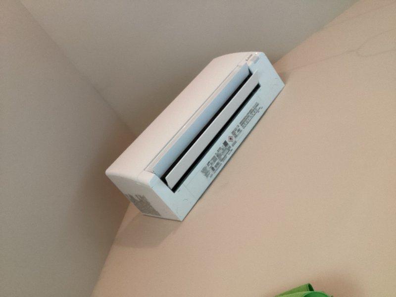 Responded to service call for chemical odor complaint on recently installed mini-split system. Cycled unit through cooling, dehumidify, and heating modes while monitoring for odor presence. Intermittent chemical smell detected during startup and shutdown cycles. Performed refrigerant leak detection scan with no leaks identified. Verified proper airflow pattern with unit drawing air from top and discharging through front vents. Unable to determine definitive odor source as unit is functioning normally and may be circulating ambient room air containing chemical smell from household products or materials. Safety placards remain intact per manufacturer requirements. Reviewed thermostat operation and system functions with homeowner.