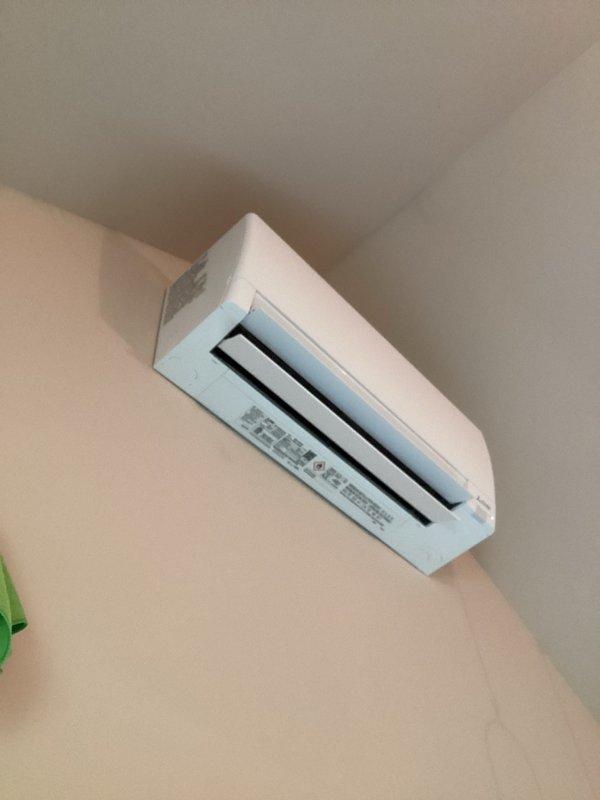 Responded to service call for chemical odor complaint on recently installed mini-split system. Cycled unit through cooling, dehumidify, and heating modes while monitoring for odor presence. Intermittent chemical smell detected during startup and shutdown cycles. Performed refrigerant leak detection scan with no leaks identified. Verified proper airflow pattern with unit drawing air from top and discharging through front vents. Unable to determine definitive odor source as unit is functioning normally and may be circulating ambient room air containing chemical smell from household products or materials. Safety placards remain intact per manufacturer requirements. Reviewed thermostat operation and system functions with homeowner.