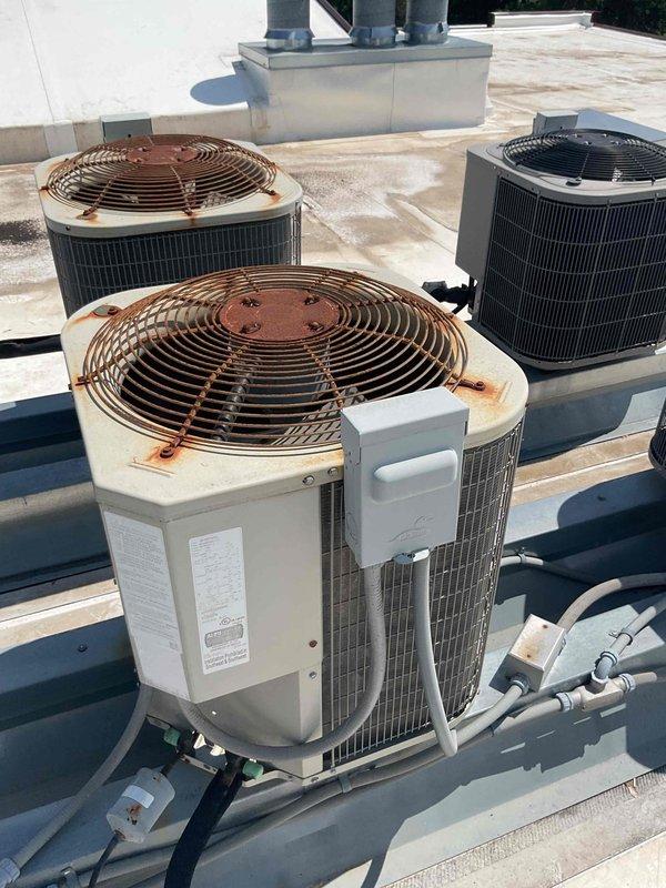 Responded to no cooling complaint at rooftop HVAC unit serving condo unit. Coordinated rooftop access through building maintenance and accessed unit via interior ceiling hatch. Diagnosed failed capacitor preventing compressor operation, resulting in warm air discharge. Replaced defective capacitor and restored cooling function to unit.