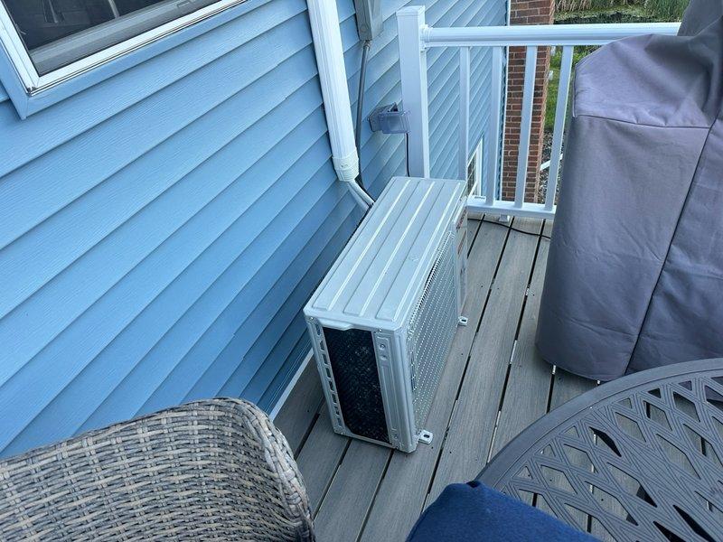 Responded to no cooling complaint on 1-year-old ductless mini-split system installed on outdoor deck. Upon inspection, determined that refrigerant lines had been disturbed during recent deck board replacement, causing flare fittings to loosen and resulting in complete refrigerant loss. Diagnosed leak at connection points where outdoor unit had been temporarily relocated. Provided estimate for pressure testing system, repairing compromised flare connections, and recharging unit to factory specifications. Customer declined repair services.