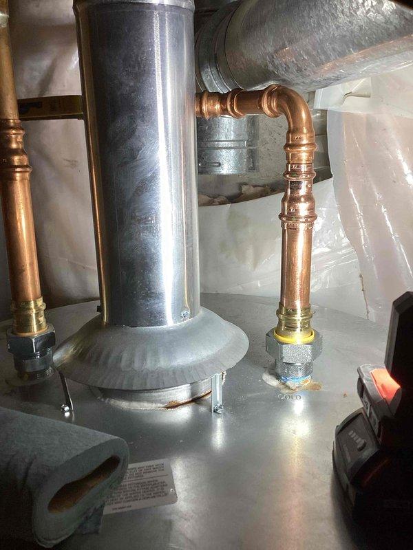 Responded to service call for reported water heater leak on 75-gallon unit approximately 2 years old. Upon inspection, determined the water heater itself was not leaking. Identified failed dielectric union as the source of water leakage. Replaced defective dielectric union with new component and verified system integrity. Unit covered under parts warranty.