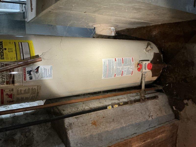 Responded to a bathtub drain that was completely non-functional due to a severely clogged custom drum trap. Upon inspection in the basement utility area, found the existing drum trap was plugged solid and beyond cleaning. Removed the obsolete drum trap assembly and replaced it with new Schedule 40 PVC trap configuration to restore proper drainage and meet current plumbing code standards.