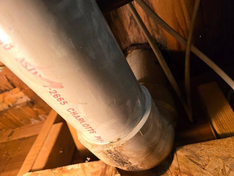 Responded to report of toilet leaking at base with water stains visible on basement ceiling below. Upon inspection, confirmed water infiltration through bathroom floor into basement area. Removed toilet from floor flange to access leak source. Found failed wax ring seal allowing water to bypass the toilet base and penetrate subflooring. Installed new wax ring seal and properly reset toilet to floor flange, ensuring watertight connection between fixture and drain system.