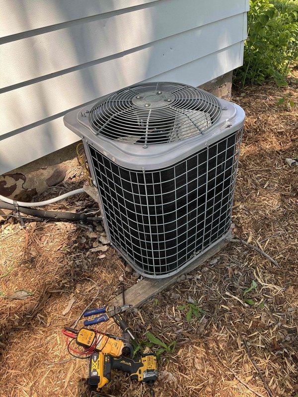 Responded to no cooling complaint where system was short cycling, running 30-45 seconds before thermostat would kick out on delay and repeat the cycle. Performed diagnostic testing on outdoor unit including low voltage verification, secured connections with new wire nuts, and ohm tested contactor coil which measured 17 ohms (within specification) and drew 0.29 amps when energized. After systematically verifying all wiring at outdoor unit, furnace, and thermostat location, determined thermostat was faulty. Replaced defective thermostat with new Honeywell Home ProSeries T4 unit, verified proper wiring connections throughout system, and monitored operation for approximately 20 minutes to confirm proper cycling with temperature降cooling to setpoint and system shutting off as designed.