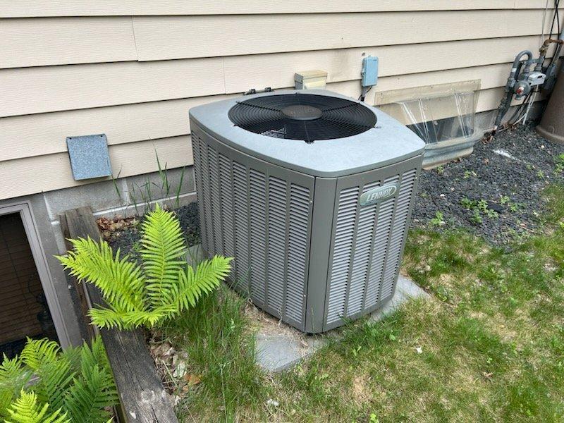 Responded to no cooling complaint on 12-year-old Lennox air conditioning system. Upon inspection, diagnosed three primary issues: low refrigerant charge, severely restricted airflow due to plugged air filter, and blocked outdoor condenser coil restricting heat transfer. Cleaned outdoor coil to restore proper airflow and heat rejection capacity. Replaced dirty air filter with new filter to ensure adequate system airflow. Added refrigerant to bring system charge to manufacturer specifications. Verified proper system operation with normal cooling restored upon completion.