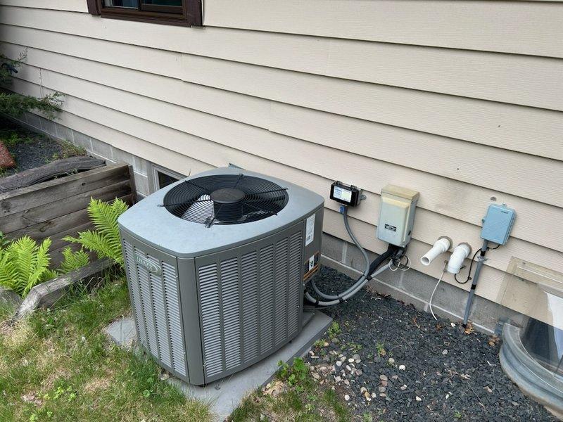 Responded to no cooling complaint on 12-year-old Lennox air conditioning system. Upon inspection, diagnosed three primary issues: low refrigerant charge, severely restricted airflow due to plugged air filter, and blocked outdoor condenser coil restricting heat transfer. Cleaned outdoor coil to restore proper airflow and heat rejection capacity. Replaced dirty air filter with new filter to ensure adequate system airflow. Added refrigerant to bring system charge to manufacturer specifications. Verified proper system operation with normal cooling restored upon completion.