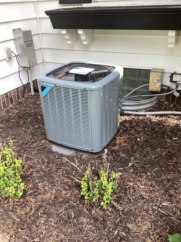 Completed preventive maintenance agreement service on residential split HVAC system with outdoor condenser unit and attic-mounted air handler. Inspected both units, verified refrigerant levels within manufacturer specifications, measured amperage draws on all components with readings in acceptable range, and replaced air filter. Both indoor and outdoor units operating properly with no deficiencies noted at time of service.