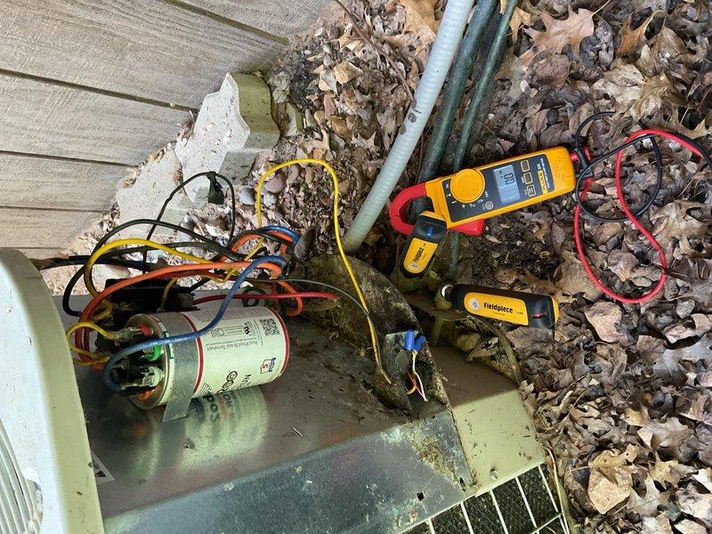 Responded to no cooling complaint on 28-year-old system. Upon inspection, discovered improperly wired dual run capacitor installed by third party—load line incorrectly connected to common terminal, causing ghost voltage to condenser fan motor. This resulted in fan operating at approximately 50% RPM continuously, leading to elevated head pressure and inadequate heat rejection. Corrected capacitor wiring to manufacturer specifications, restoring proper fan operation and system cooling. Noted significant rust and corrosion on fan grille and mounting components consistent with unit age and outdoor exposure. Refrigerant charge verified within acceptable range. Provided estimate for condenser fan motor replacement as preventive measure due to potential damage from prolonged operation at reduced speed. Customer declined immediate repair, opting to attempt self-installation; scheduled follow-up advisory appointment for technical guidance.