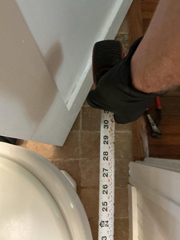 Replaced existing toilet that was experiencing slow flushing issues with a new Gerber round front toilet featuring a 14-inch rough-in configuration to ensure proper clearance from the bathroom door. Installation included new wax ring, mounting bolts, and complete fixture setup. Upon completion, tested toilet for proper flush operation and verified no leaks were present at all connection points.
