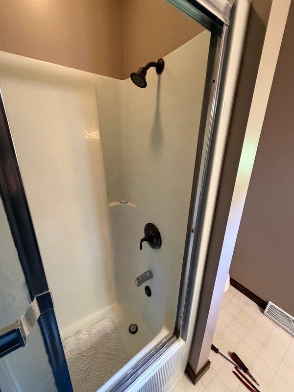 Responded to service call for loose toilet seat that was not sitting correctly on the toilet bowl. Reinstalled and properly secured toilet seat by tightening mounting bolts to manufacturer specifications. Upon request, inspected bathroom shower fixtures and identified loose shower handle assembly. Tightened shower handle mounting hardware to restore proper operation and stability. All fixtures tested and confirmed secure upon completion.