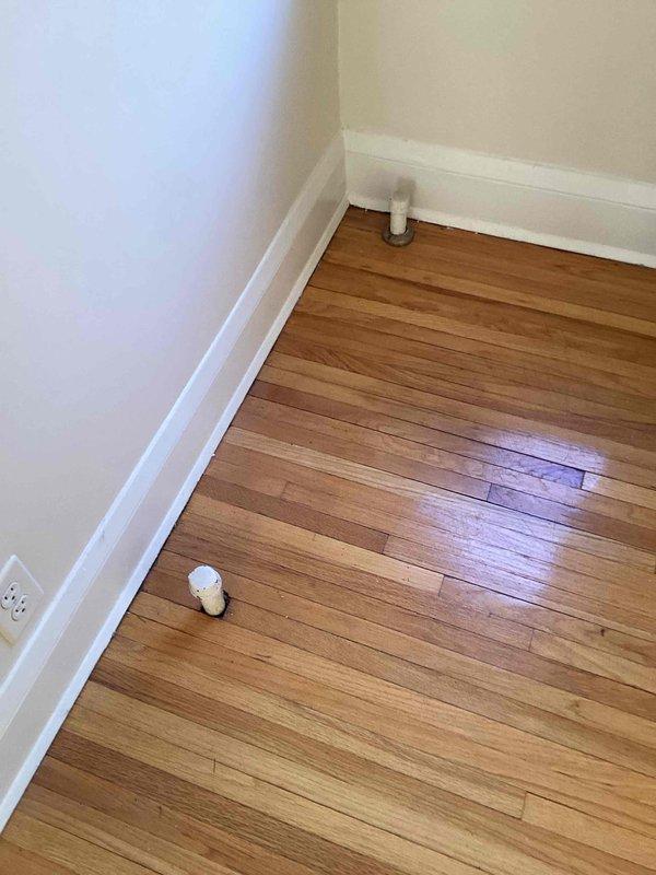 Responded to service call for radiator removal and assessment. Removed two radiator caps in the living room to allow for carpeting installation. Inspected upstairs unit to verify radiator connections to the boiler system. Assessed feasibility of removing piping from old boiler radiator and determined that floor cutting would be necessary to properly remove and cap off the lines. Customer declined to proceed with piping removal due to floor cutting requirement.