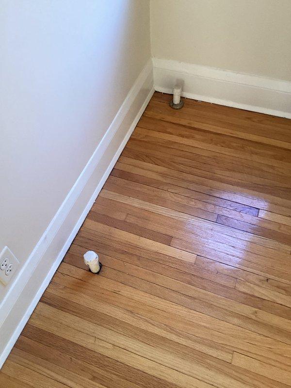 Responded to service call for radiator removal and assessment. Removed two radiator caps in the living room to allow for carpeting installation. Inspected upstairs unit to verify radiator connections to the boiler system. Assessed feasibility of removing piping from old boiler radiator and determined that floor cutting would be necessary to properly remove and cap off the lines. Customer declined to proceed with piping removal due to floor cutting requirement.