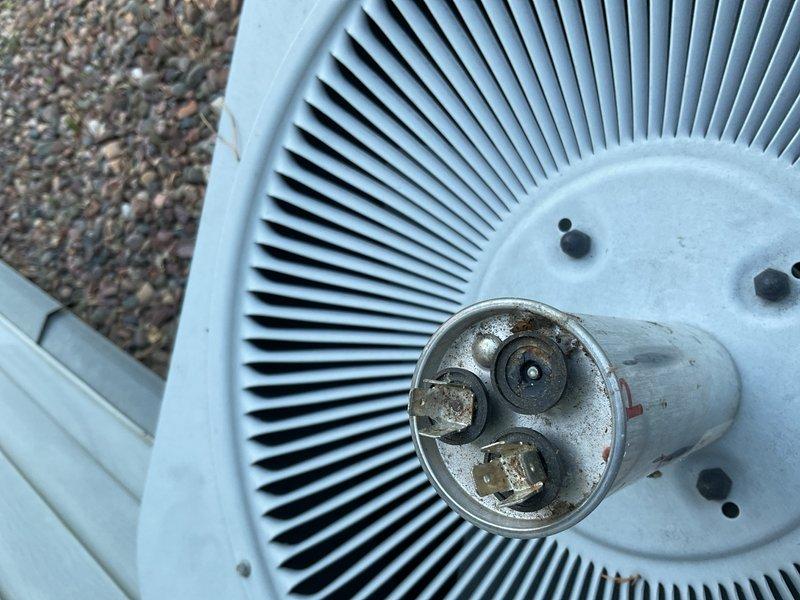 Responded to no cooling call on 10-12 year old air conditioning system. Upon arrival, diagnosed failed dual run capacitor reading zero microfarads, causing compressor to draw excessive amperage and trip the circuit breaker. Removed and replaced defective capacitor with proper rated replacement. Performed condenser coil cleaning to remove accumulated dirt and debris, improving heat transfer efficiency. Verified proper system operation, confirmed normal amperage draw, and tested all safety controls. Unit restored to full cooling capacity.