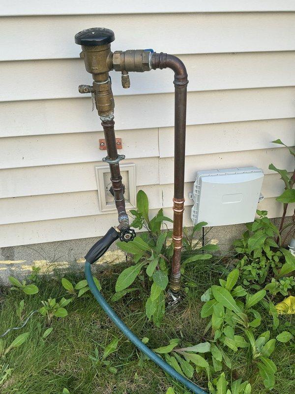 Responded to exterior water leak at outside faucet connected to irrigation system. Upon inspection, found hose bib attachment loose and a 1-inch press ball valve that had failed and blown apart. Tightened the loose hose bib connection and repaired the 1-inch press coupling to restore proper function and eliminate the leak.