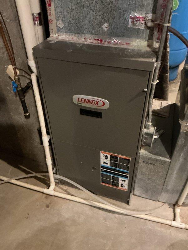 Responded to no-cool call on 22-year-old Lennox furnace system with non-operational outdoor condensing unit. Upon inspection, identified multiple critical component failures including blower motor with oil leak, draft inducer motor malfunction, and failed control board exhibiting extensive rust and corrosion damage from moisture exposure. Performed refrigerant leak search on outdoor unit, completed system recharge, and replaced defective blower motor, exhaust inducer motor, and corroded control board. Recommended comfort advisor consultation due to age of equipment and extent of deterioration observed throughout system components.