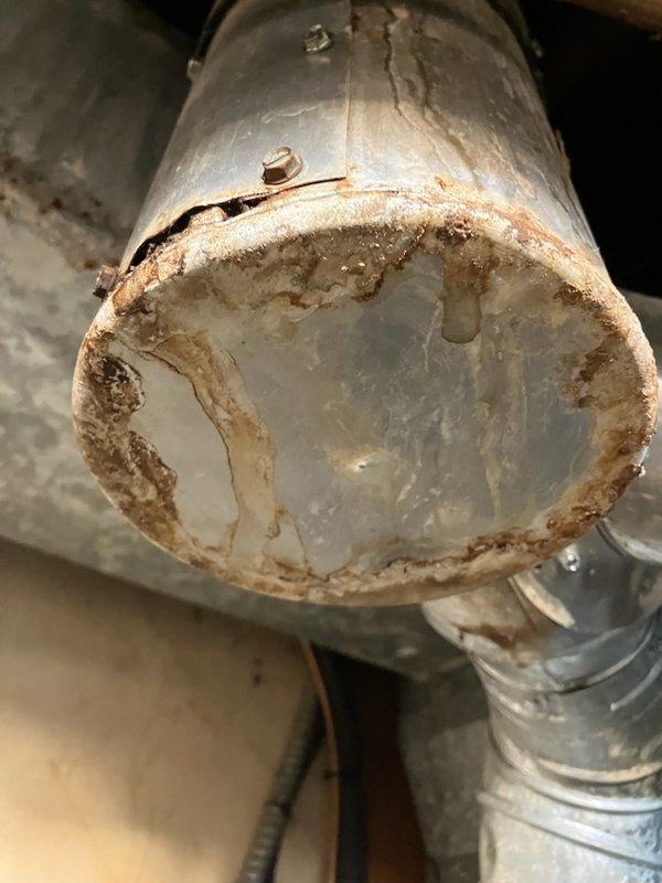 Responded to service call for equipment inspection and furnace maintenance at residential property. Investigated dryer vent configuration and found metal flex duct connected to vinyl flex duct transitioning to rigid duct at exterior termination. Identified vinyl flex duct section as non-compliant with code requirements and referred homeowner to duct cleaning specialist for proper remediation. Inspected exhaust drop tee exhibiting surface rust and corrosion but confirmed structural integrity remains intact with no compromise to functionality.

Performed comprehensive tune-up on five-year-old Goodman furnace system. Conducted full system diagnostics including component function testing, flame sensor cleaning, and combustion analysis. Verified all operational parameters within manufacturer specifications. System operating properly with no deficiencies identified and no recommendations required at this time.