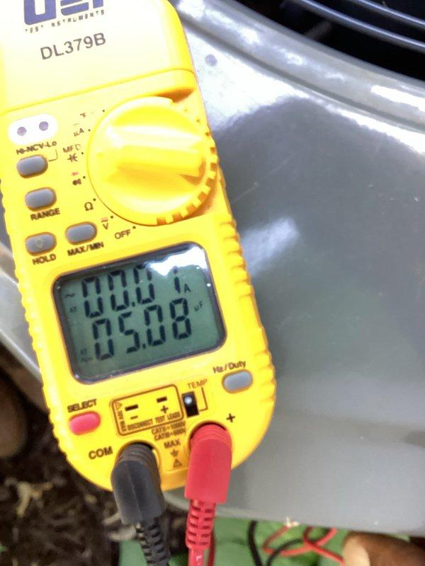 Completed routine AC maintenance tune-up on system. Performed standard diagnostics including electrical measurements with multimeter and verified thermostat operation showing 76°F with fan running. No issues found during inspection.
