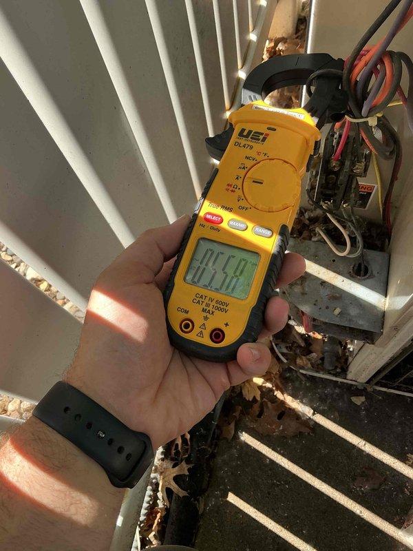 Responded to no cooling call on 32-year-old Lennox R22 air conditioning system with indoor fan operational but outdoor unit not running. Found tripped breaker at electrical panel, reset breaker and confirmed outdoor unit operation. Performed amp draw testing which revealed compressor drawing higher than normal amperage relative to ambient temperature conditions, indicating internal compressor wear. Attempted refrigerant pressure diagnostics but high-side service port was inaccessible; low-side pressure reading suggested system is slightly undercharged on R22 refrigerant. Due to age of equipment, compressor wear indicators, and EPA regulations prohibiting major repairs on R22 systems, recommended full system replacement and scheduled follow-up consultation for replacement options.