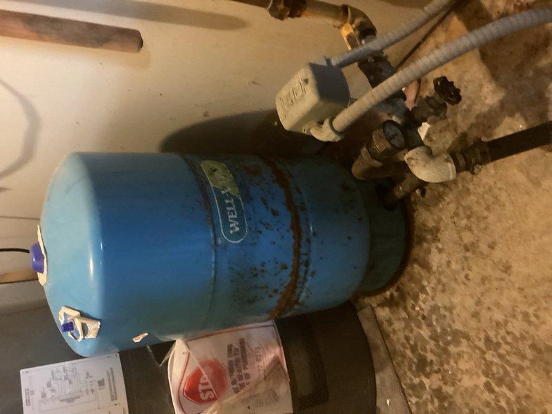 Responded to service call for sump pump humming loudly during operation and well tank clicking issues. Upon inspection, discovered the well pressure tank was waterlogged and failing to maintain proper pressure cycling. The pressure switch was also malfunctioning, causing excessive cycling and the clicking noise reported by the customer. Performed diagnostic testing on the existing well system and confirmed the bladder in the pressure tank had failed, resulting in the tank being completely filled with water rather than maintaining the proper air-to-water ratio. Provided detailed estimate for replacement of the well pressure tank and pressure switch to restore proper system operation and eliminate the humming and clicking issues.