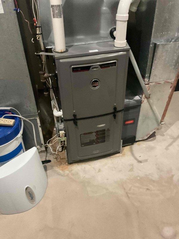 Completed comprehensive HVAC maintenance agreement including tune-up service on dual air conditioning systems and furnace inspection. Performed standard preventive maintenance procedures on both 2-year-old Ruud AC condensing units, including filter replacement and system performance verification. Investigated reported water accumulation at furnace base, inspected condensate drainage system, and assessed overall furnace operation to ensure proper functionality of heating equipment.