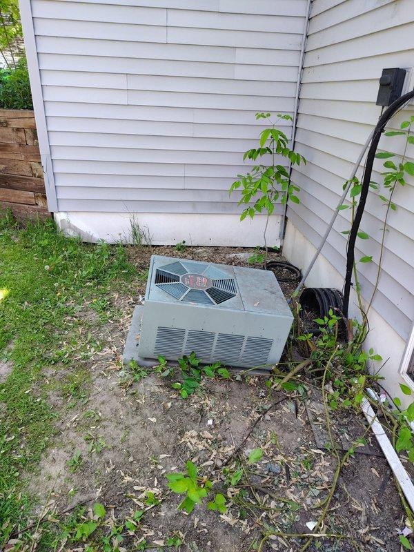 Responded to no-cool call on 2008 Ruud outdoor condensing unit. Upon arrival, unit was attempting to start but failing to run, with audible clicking from contactor and loud buzzing noise. Diagnosed failed capacitor with no measurable capacitance and severely pitted contactor causing poor electrical contact. Replaced both capacitor and contactor with OEM-equivalent parts. Rinsed outdoor coil to remove debris accumulation. Verified proper system startup with 18-degree temperature split across evaporator coil, confirming adequate cooling performance restored.