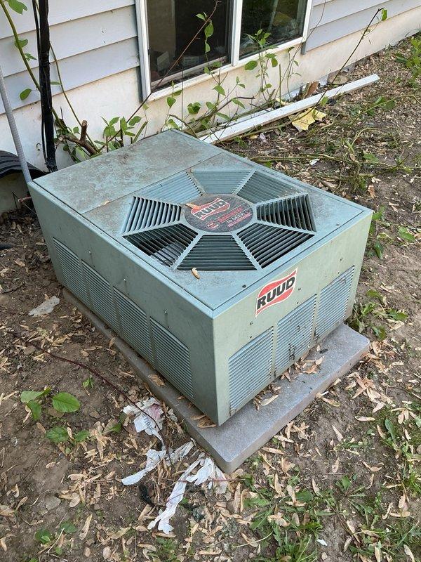 Responded to no-cool call on 2008 Ruud outdoor condensing unit. Upon arrival, unit was attempting to start but failing to run, with audible clicking from contactor and loud buzzing noise. Diagnosed failed capacitor with no measurable capacitance and severely pitted contactor causing poor electrical contact. Replaced both capacitor and contactor with OEM-equivalent parts. Rinsed outdoor coil to remove debris accumulation. Verified proper system startup with 18-degree temperature split across evaporator coil, confirming adequate cooling performance restored.