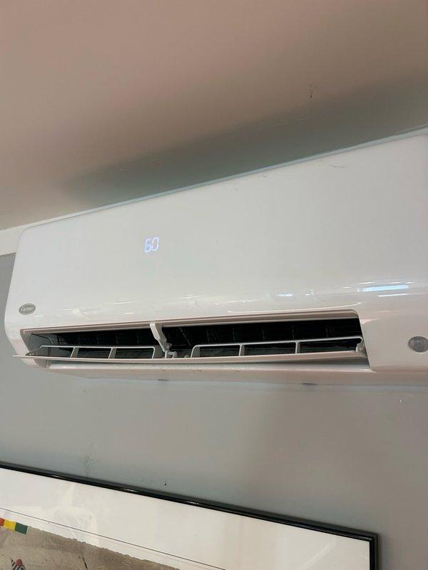 Responded to no cooling complaint on two of four mini-split indoor units that were cycling on and off every few minutes. Performed system diagnostics and pressure testing on affected heads, confirming complete loss of refrigerant charge with extremely low pressure readings. Documented equipment model information and captured photographic evidence of both indoor wall-mounted units and exterior condensing unit connections. Submitted parts quote request for replacement of both non-functional indoor air handlers, which was approved by customer for installation prior to property sale.