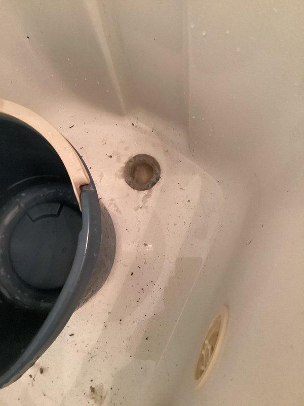 Responded to service call for shower cartridge inspection and toilet evaluation. Upon assessment, identified leaking tub spout with water discharge from the backside connection point. Determined existing tub spout was defective and required replacement. Successfully removed old tub spout and installed new unit, ensuring proper seal and connection to eliminate leak. Verified installation with pressure test to confirm no further water seepage from backside of fixture.