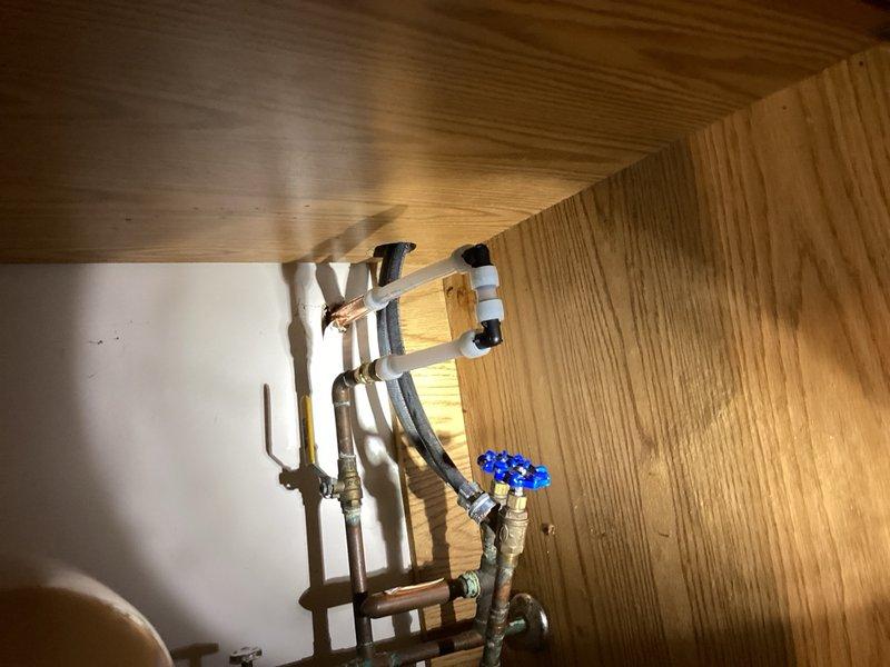 Responded to emergency call for frozen outdoor hose bibb that leaked into laundry room. The existing hose bibb had previously been identified as needing replacement and had now failed, causing water intrusion inside the home. Shut off water supply to the affected fixture to prevent further flooding. Removed damaged frozen hose bibb and installed new frost-proof hose bibb with proper valve assembly. Tested new installation for leaks and verified proper operation of shut-off valve with blue handle. Confirmed no additional water intrusion and restored exterior water access.