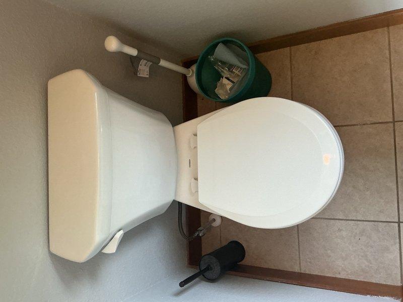 Replaced three standard height toilets with new units including wax rings, mounting bolts, and complete installation. Installed a 20-inch whole house sediment and rust filter with 1-inch inline connection to address excessive sand and sediment contamination affecting plumbing fixtures throughout the residence. Replaced one toilet shut-off valve and supply line to prevent future water damage and ensure proper emergency shut-off capability. All installations completed to manufacturer specifications with filter system designed to capture sediment, dirt, and rust particles, protecting fixtures from mineral damage and staining while improving water quality.