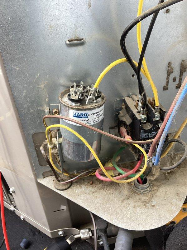 Responded to no cooling call on 10+ year old air conditioning system with tripped breaker and non-functioning outdoor unit. Upon inspection, discovered system was slightly undercharged on refrigerant. Added one pound of refrigerant to bring system to proper operating charge, verified acceptable temperature split across evaporator coil, and confirmed outdoor unit returned to normal operation. System restored to cooling capacity with indoor fan and outdoor condenser unit both functioning properly.