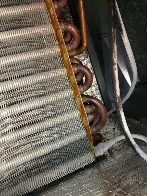 Responded to no cooling complaint on third-level AC unit approximately 10+ years old. Upon inspection, found system operating with low R-410A refrigerant charge. Added UV dye to refrigerant circuit to facilitate leak detection and recharged system to proper operating levels. Unit restored to cooling operation for immediate use. Follow-up appointment to be scheduled by property owner in coming weeks to locate and repair refrigerant leak once dye has circulated through system.