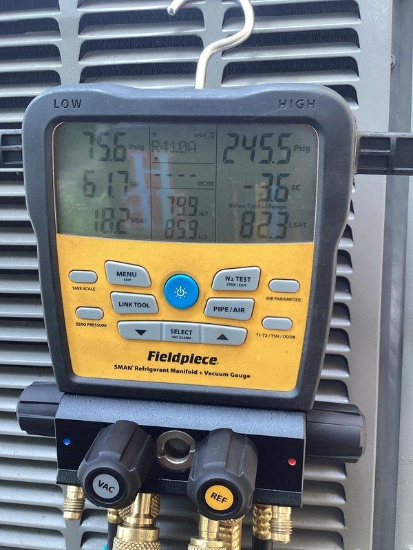 Responded to no cooling complaint on third-level AC unit approximately 10+ years old. Upon inspection, found system operating with low R-410A refrigerant charge. Added UV dye to refrigerant circuit to facilitate leak detection and recharged system to proper operating levels. Unit restored to cooling operation for immediate use. Follow-up appointment to be scheduled by property owner in coming weeks to locate and repair refrigerant leak once dye has circulated through system.