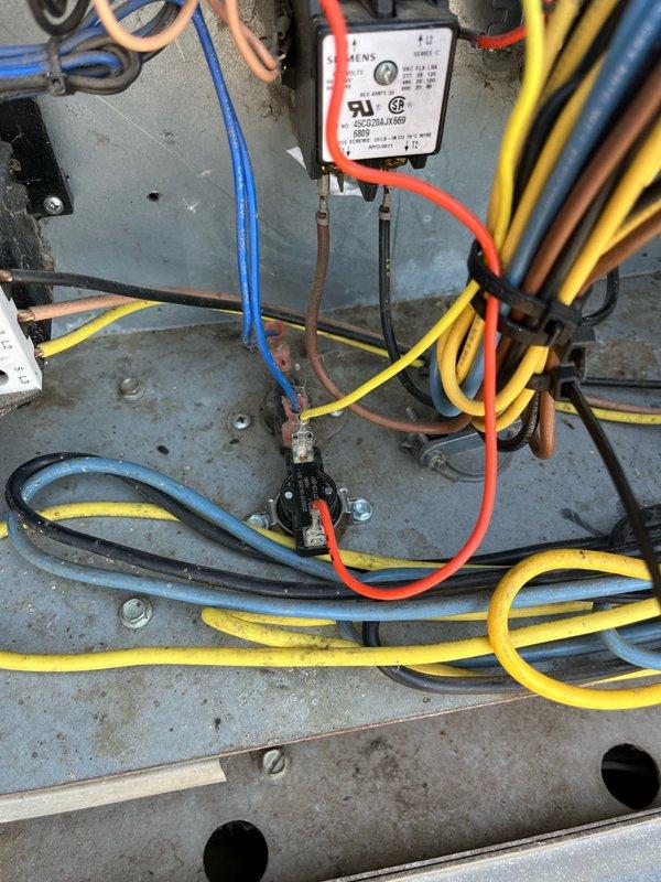 Responded to no cooling complaint on rooftop unit. Upon arrival, unit displayed high-pressure switch fault code for compressor. Observed one condenser fan motor not operating. Performed system reset and monitored operation for approximately 10 minutes. During observation period, the non-operational condenser fan cycled off for several minutes before restarting. However, compressor had already overheated during fan failure, triggering high-pressure safety lockout. Identified faulty limit switch or sensor in condenser compartment controlling intermittent fan operation. Discovered completely plugged air filters restricting airflow, contributing to elevated system pressures and inadequate cooling performance. Recommended replacement of condenser fan limit switch and installation of new air filters to restore proper system operation. Unit providing limited cooling at time of departure but requires component replacement to resolve intermittent fan failure and prevent recurring high-pressure 