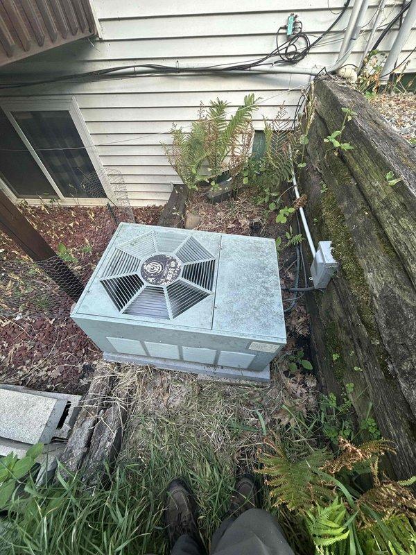 Responded to no cooling complaint on 1996 Rheem air conditioning system. Upon arrival, homeowner reported unit had been icing up repeatedly despite cleaning both condenser and evaporator coils. Connected manifold gauges to system and measured suction pressure at approximately 5 psi, indicating severe refrigerant loss. System is operating on R-22 refrigerant and essentially flat. Discussed refrigerant options, EPA regulations, and certification requirements with homeowner. Recommended system replacement due to age of equipment and refrigerant phase-out. Homeowner declined immediate replacement and will discuss options with family.