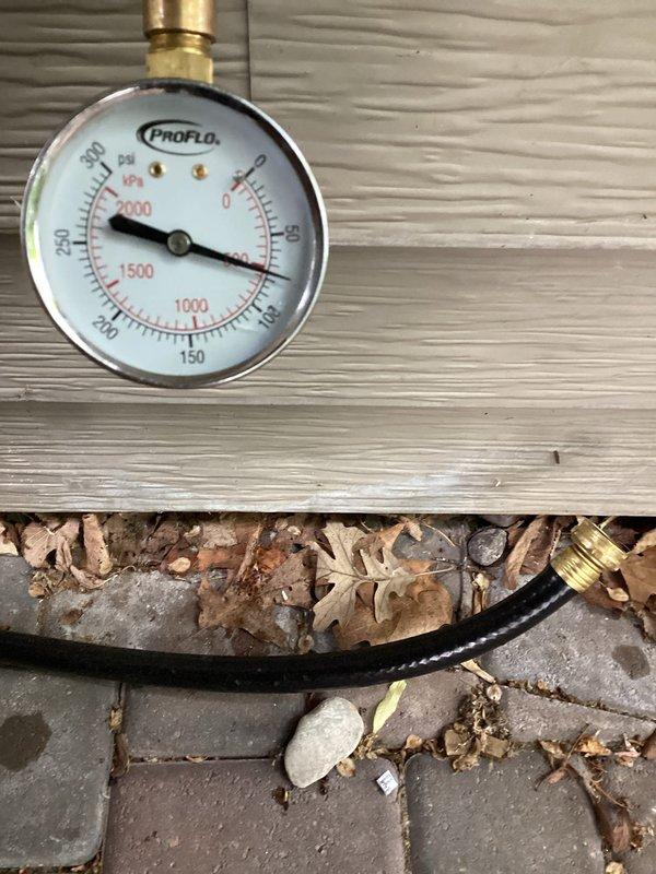 Replaced defective pressure reducing valve on residential water system. Initial water pressure measured at 110 PSI, which exceeded safe operating parameters for household plumbing fixtures and appliances. Installed new PRV and adjusted settings to reduce system pressure to 75 PSI, establishing proper fill pressure and protecting the plumbing system from excessive strain.