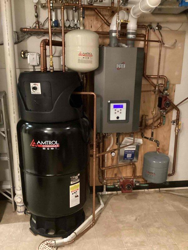 Completed biannual plumbing inspection including comprehensive evaluation of water heater, water softener, sump pump, and laundry hose connections. Performed leak detection throughout plumbing system and inspected all accessible piping, valves, and fixtures. Verified proper operation of Amtrol water heater and expansion tanks, examined copper piping network for signs of corrosion or deterioration, and confirmed drainage systems functioning correctly.