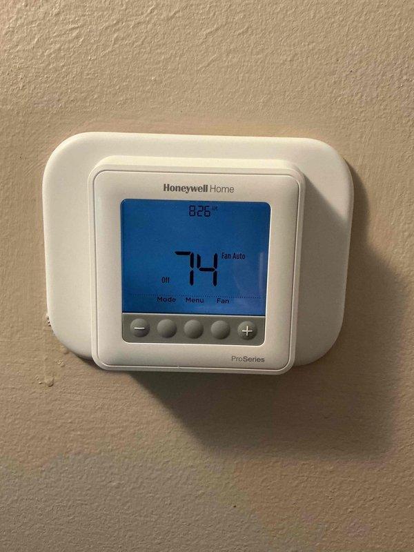 Responded to first call for failed thermostat. Removed existing non-functional thermostat from wall and installed new Honeywell Home Focus Pro programmable thermostat as replacement. Configured new unit for proper system operation, verified cooling and fan functions operating correctly, and confirmed accurate temperature display and control settings. System tested and returned to full functionality.