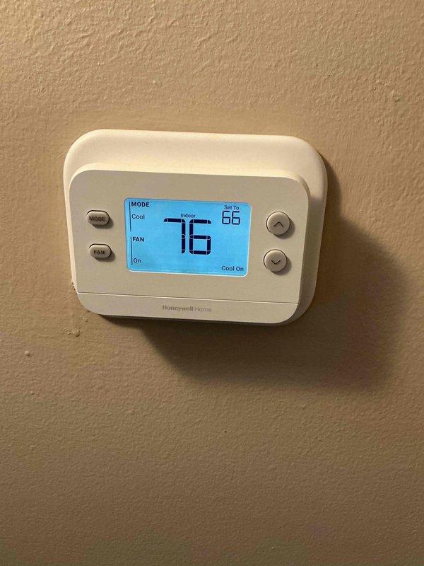 Responded to first call for failed thermostat. Removed existing non-functional thermostat from wall and installed new Honeywell Home Focus Pro programmable thermostat as replacement. Configured new unit for proper system operation, verified cooling and fan functions operating correctly, and confirmed accurate temperature display and control settings. System tested and returned to full functionality.