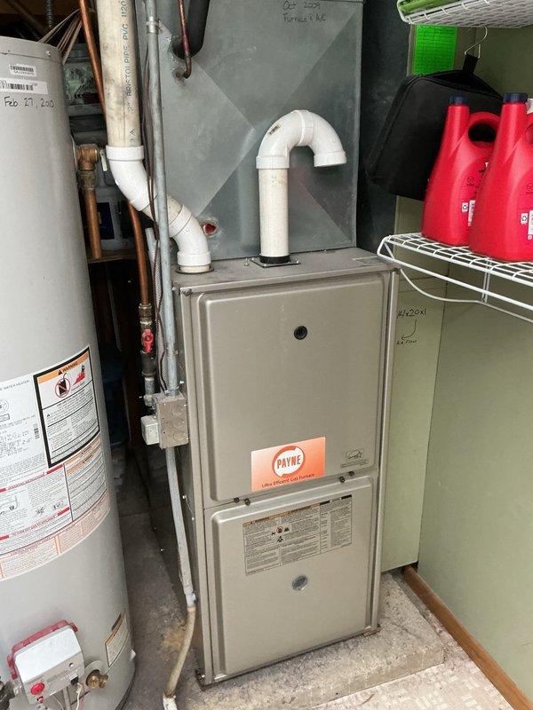Responded to no cooling complaint on 15-year-old Payne HVAC system. Upon arrival, confirmed system was running but not producing cool air. Performed diagnostic inspection including air filter check, blower verification, and airflow assessment—all within normal parameters. Inspected outdoor condenser coil, found minor debris accumulation, and performed light rinse to restore optimal heat transfer. Conducted refrigerant pressure test and identified system was significantly low on charge. After discussing repair options with homeowner, who indicated plans for system replacement within one year, proceeded with refrigerant recharge without leak detection dye service per customer request. Recharged system to manufacturer specifications, verified proper operation, and confirmed 22-degree temperature split across evaporator coil. System restored to normal cooling operation.