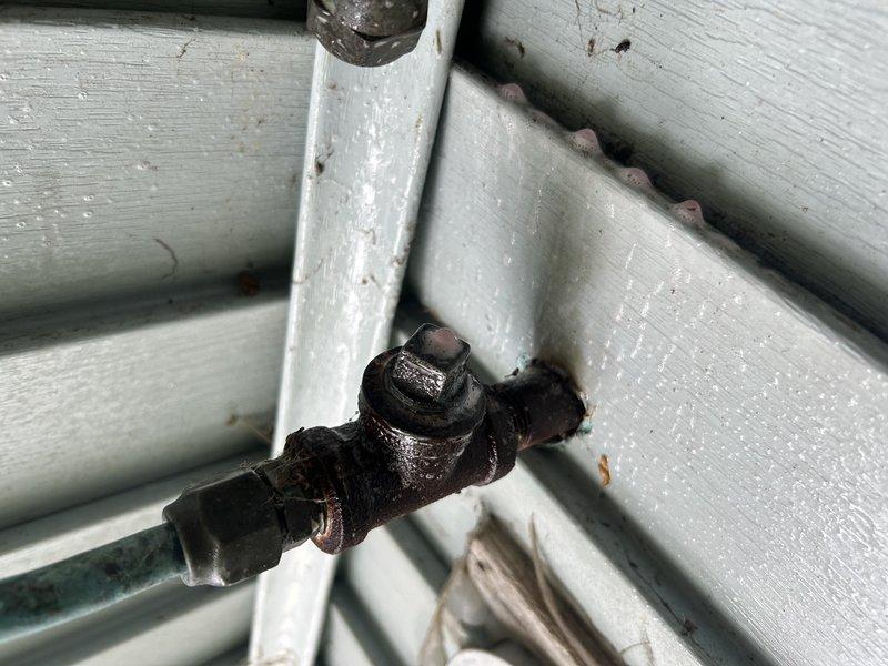 Responded to utility company requirement to cap disconnected gas line serving old pool heater. Located main gas supply entry point and shut off gas to home. Identified pool heater gas line exit point at exterior wall before line runs underground. Successfully capped gas line at exterior wall location, allowing for future removal of underground portion during landscaping work. Performed leak check on capped line and verified system integrity. All work completed to code with no leaks detected.