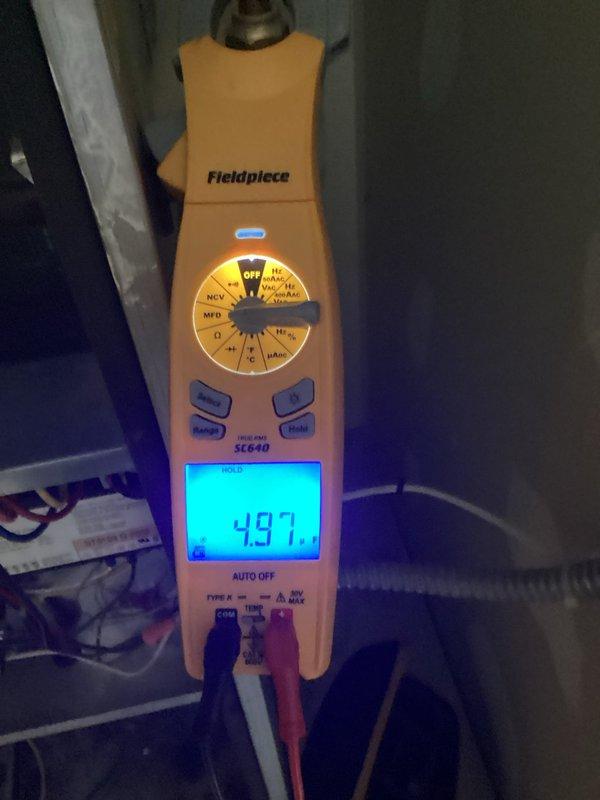 Completed scheduled air conditioning tune-up and maintenance inspection on 15-year-old residential cooling system as part of preventative maintenance agreement. Performed comprehensive system evaluation including electrical panel inspection and voltage testing, recording 497 volts at the disconnect. All components operating within normal parameters with no deficiencies identified; system confirmed in good working condition.