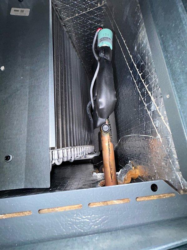 Performed air conditioning tune-up and diagnosed heat pump system with inadequate cooling performance. Initial temperature split measured at 11°F, indicating system inefficiency. Determined unit was overcharged with refrigerant after ruling out dirty filter and coil restrictions. Recovered excess refrigerant from system and restored proper charge levels. Verified normal operation with improved temperature split of 16°F, confirming resolution of cooling issue.