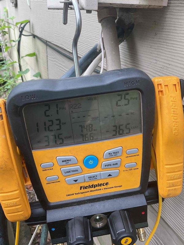 Responded to no cooling complaint on residential air conditioning system. Upon inspection, found unit operational but not producing cold air. Diagnostic testing with manifold gauges revealed critically low refrigerant charge in R-22 system. Due to age of equipment (10+ years), phase-out of R-22 refrigerant, and cost of repair versus replacement, recommended system replacement rather than recharging obsolete refrigerant.