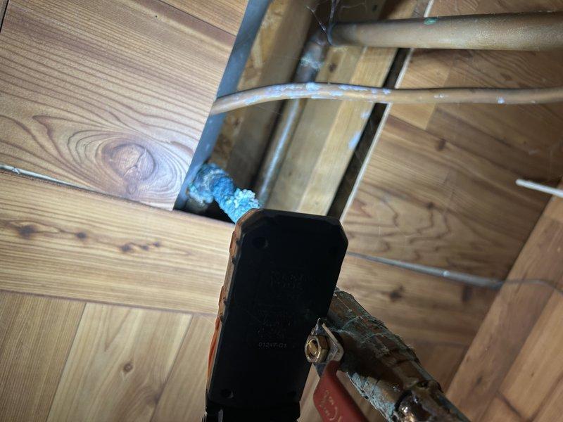 Responded to service call for inadequate cooling and weak airflow. Upon inspection, discovered a leaking evaporator drain pan causing water to cascade onto the secondary heat exchanger, blower assembly, and furnace components. Found extensive rust and corrosion on burners, gas valve, and ECM blower motor due to ongoing water intrusion. Secondary heat exchanger showed water saturation and debris accumulation, contributing to restricted airflow. The AC system (1990) and furnace (2013) both exhibited moisture damage throughout. Diagnosed that evaporator coil replacement is necessary to resolve the leak at its source. Recommended complete evaporator coil replacement along with cleaning of secondary heat exchanger and blower wheel to restore proper system operation and prevent further water damage to furnace components.