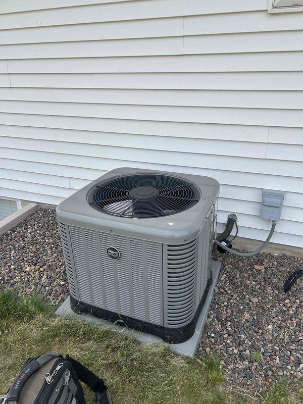 Completed annual cooling system maintenance and tuneup on residential air conditioning system. Performed comprehensive inspection of indoor furnace unit and outdoor condensing unit. Verified all components operating within manufacturer specifications. Checked refrigerant levels, electrical connections, and airflow through system. Inspected air filter access point marked on ductwork. Examined condensate drain lines for proper operation. Tested outdoor unit fan operation and verified proper condenser coil condition. All equipment found to be functioning properly with no issues identified or repairs required.