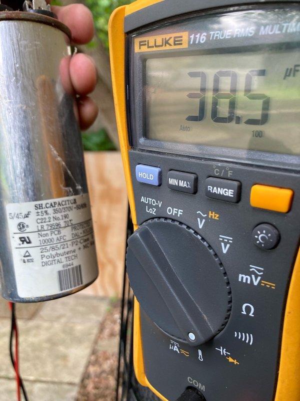 Completed tune-up on 20-year-old attic-mounted R22 air conditioning system. Performed system diagnostics revealing capacitor reading 45/5 MFD versus rated 38/4 MFD, indicating capacitor degradation. Refrigerant analysis showed low side at 55 PSI with 38° superheat and 30° vapor saturation temperature; high side at 149 PSI with 2° subcooling and 82° liquid saturation temperature; delta-T measured at 13°. Documented findings with photos of failed capacitor and outdoor condenser unit. Advised customer of system condition and provided options for repair; customer will contact office to schedule estimate for necessary repairs.