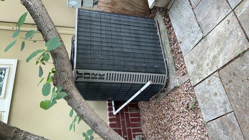 Completed tune-up on 20-year-old attic-mounted R22 air conditioning system. Performed system diagnostics revealing capacitor reading 45/5 MFD versus rated 38/4 MFD, indicating capacitor degradation. Refrigerant analysis showed low side at 55 PSI with 38° superheat and 30° vapor saturation temperature; high side at 149 PSI with 2° subcooling and 82° liquid saturation temperature; delta-T measured at 13°. Documented findings with photos of failed capacitor and outdoor condenser unit. Advised customer of system condition and provided options for repair; customer will contact office to schedule estimate for necessary repairs.